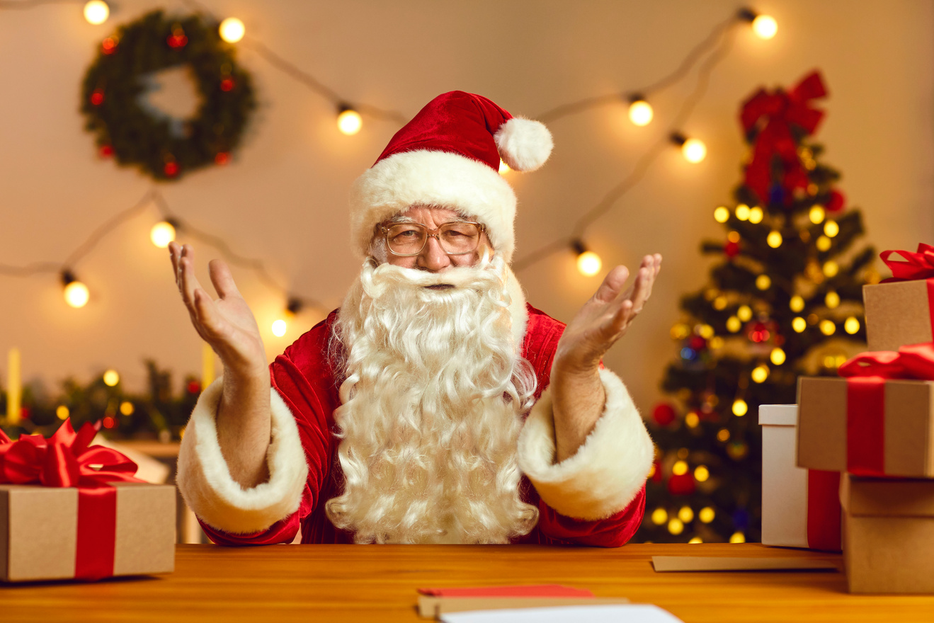 Happy Santa Claus Talking on Video Call with Kids Using Webcam on Laptop. Christmas Background.